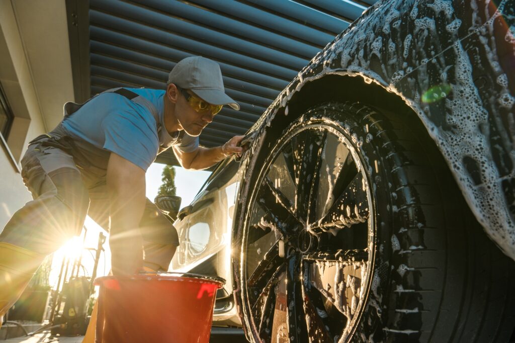 Car Owner Hand Washing His Modern Vehicle